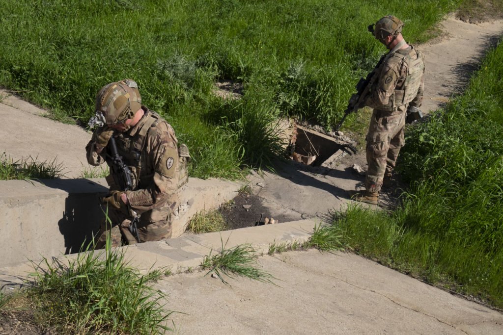 Jaqcues and Zimmerman inspect a large bunker. Photo by Kevin Knodell/Coffee or Die.