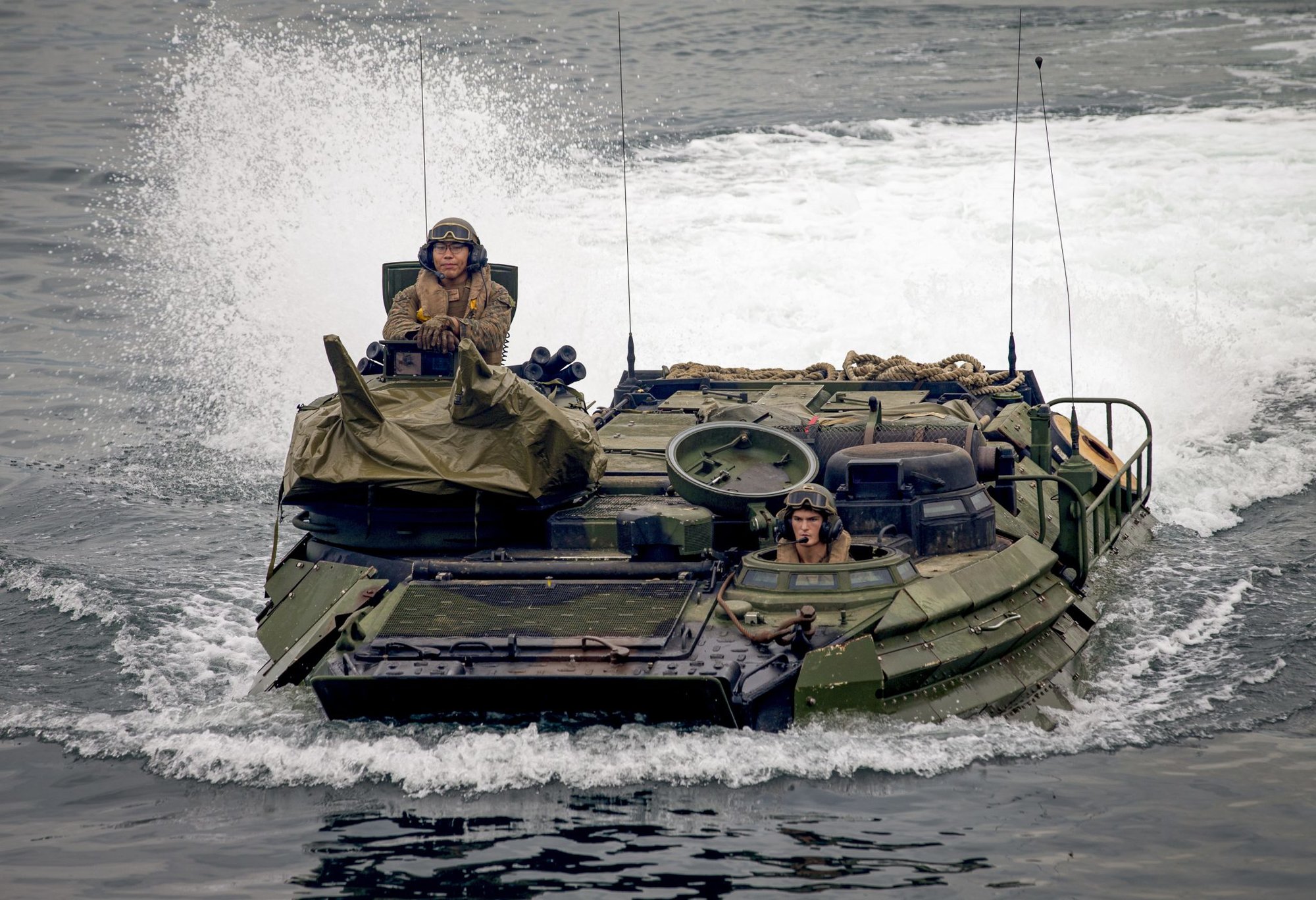 US Marines in an Assault Amphibious Vehicle prepare to embark the USS Ashland Oct. 3, 2018. US Marine corps photo by Lance Cpl. Christine Phelps.