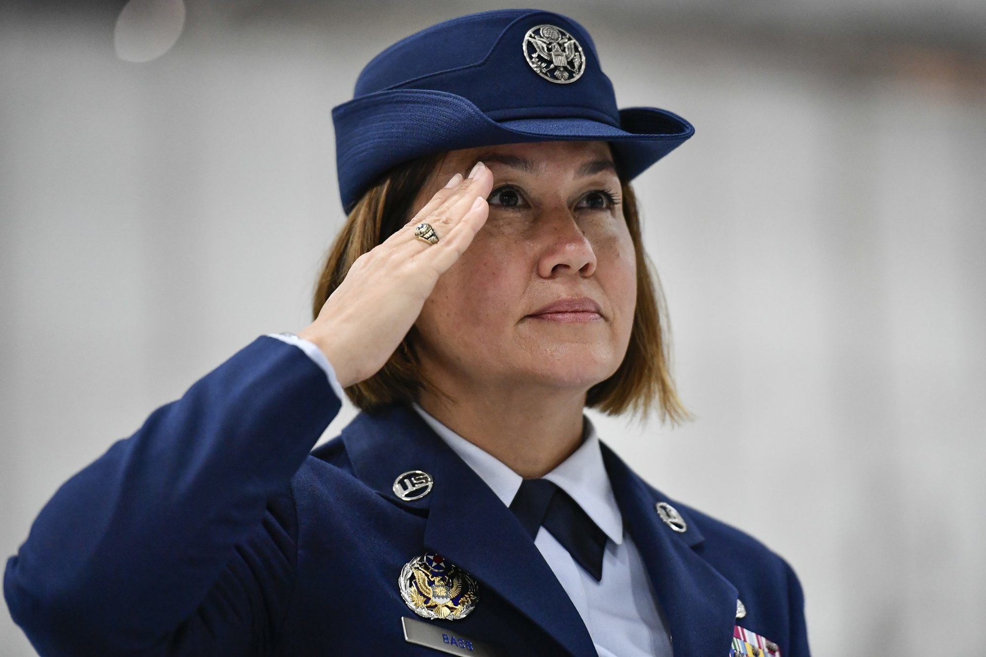 Chief Master Sgt. JoAnne S. Bass salutes during the national anthem at the beginning of a transition ceremony at Joint Base Andrews, Md., Aug. 14, 2020. Bass succeeded Chief Master Sgt. of the Air Force Kaleth O. Wright as the 19th chief master sergeant of the Air Force. (U.S. Air Force photo by Eric Dietrich)