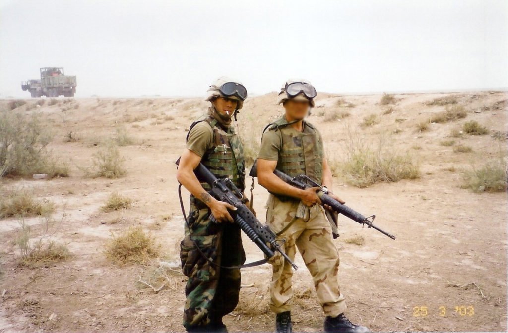 U.S. Marine Lance Corporal Chris Fleming just north of Nasiriyah during the invasion of Iraq in 2003. Photo courtesy of Chris Fleming.