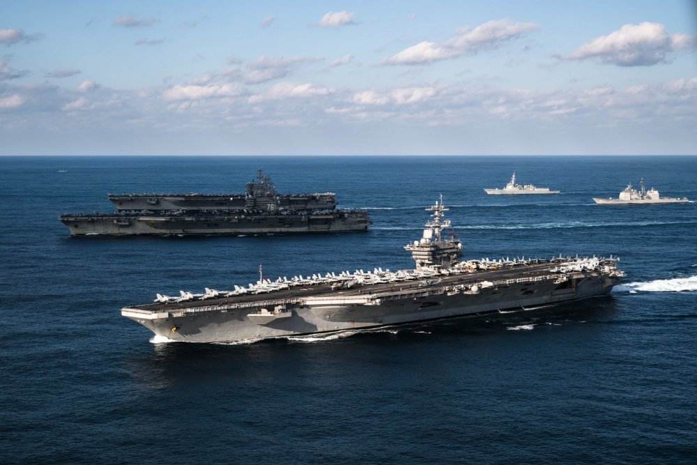 WESTERN PACIFIC (Nov. 12, 2017) The aircraft carriers USS Ronald Reagan (CVN 76), USS Theodore Roosevelt (CVN 71) and USS Nimitz (CVN 68) transit the Western Pacific. U.S. Navy photo by Lt. Aaron B. Hicks/Released.