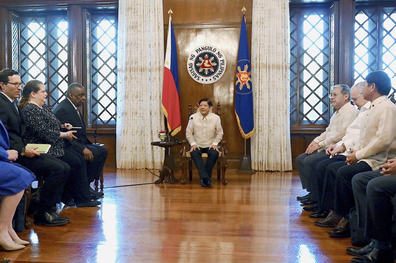 Philippine President Ferdinand Marcos Jr., center, talks with U.S. Secretary of Defense Lloyd James Austin III, third from left, during a courtesy call at the Malacanang Palace in Manila, Philippines on Thursday, Feb. 2, 2023. (Jam Sta Rosa/Pool Photo via AP)