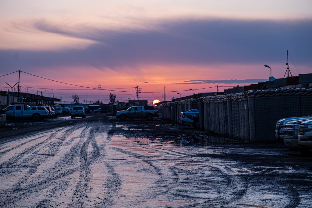 Sunset at Camp Taji, March 2020. The base was the target of three rocket attacks that month, killing two American troops and a British soldier and wounding several others. Photo by Kevin Knodell/Coffee or Die.