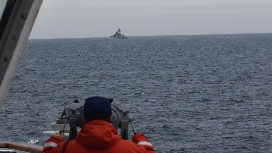 A crew member from the US Coast Guard cutter Kimball tracks a foreign vessel in the Bering Sea on Sept. 19, 2022. US Coast Guard photo.