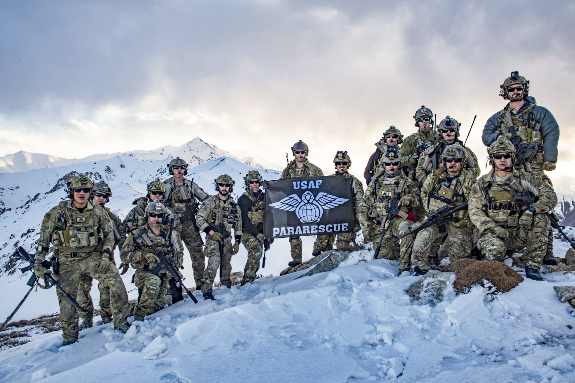 U.S. Air Force pararescuemen, assigned to the 83rd Expeditionary Rescue Squadron, Bagram Airfield, Afghanistan, pose for a team photo after the completion of a training exercise March 14, 2018. The Army crews and Air Force Guardian Angel teams conducted the exercise to build teamwork and procedures as they provide joint personnel recovery capability, aiding in the delivery of decisive airpower for U.S. Central Command. (U.S. Air Force Photo by Tech. Sgt. Gregory Brook)