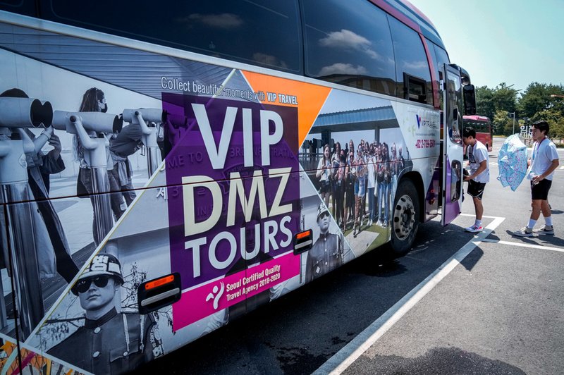 A banner advertising DMZ tour is attached at a tourist bus at the Imjingak Pavilion in Paju, South Korea, near the border with North Korea.