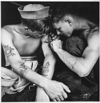 Much-tattooed sailor aboard the USS New Jersey, WWII. Photo courtesy of the US National Archives and Records Administration.