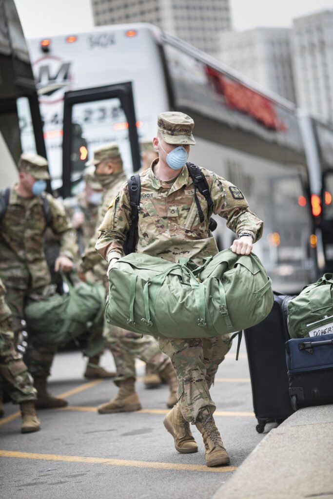 Buses carrying soldiers from Urban Augmentation Medical Task Force 801-2 arrive at the Marriot Hotel Renaissance Center in Detroit, Michigan, April 10, 2020. Photo by Spc. Brian Pearson, courtesy of the U.S. Army.