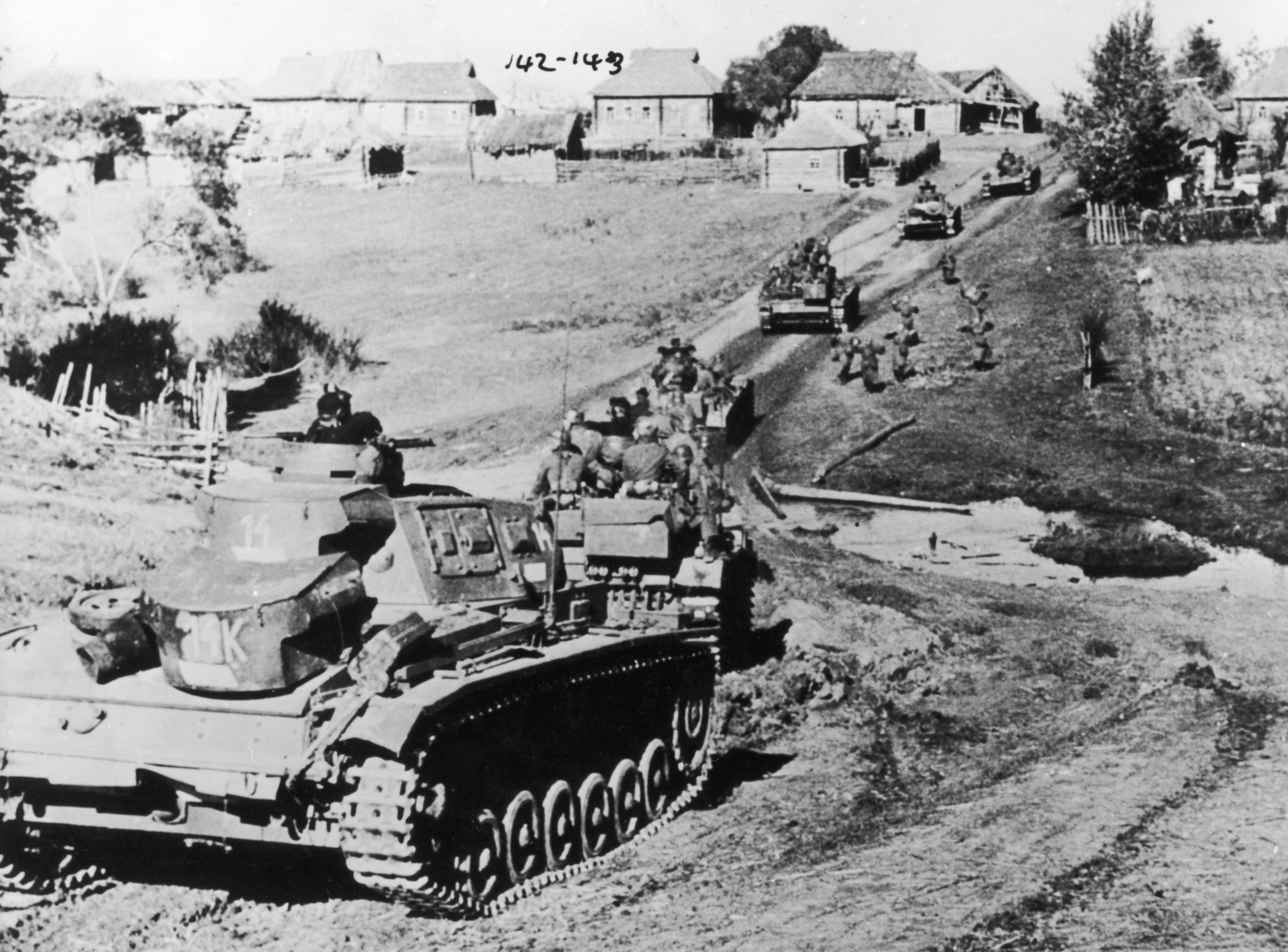 A Photograph of German Tanks Advancing towards a Soviet Village during Operation Barbarossa.  October 29th, 1941.   Photo by Fotosearch/Getty Images.