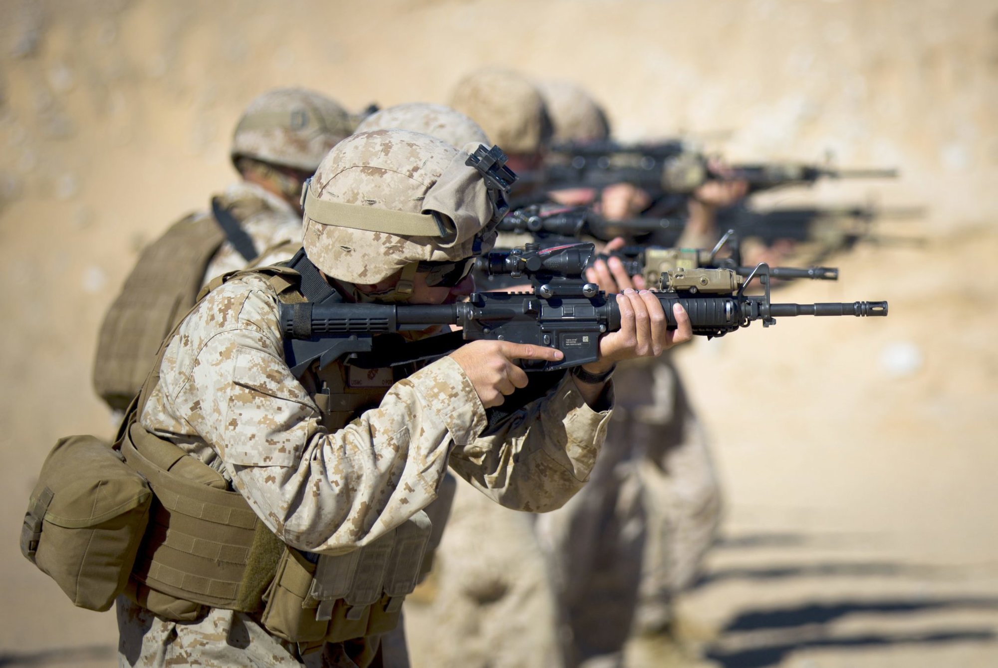 U.S. Marines assigned to Headquarters Company, 4th Marine Regiment, fire down range during the Table 3 course of fire at Range 105-A aboard Camp Wilson, Marine Corps Air Ground Combat Center Twentynine Palms, Calif., Jan. 23, 2015. Integrated Training Exercise (ITX) 2-15, being executed by Special Purpose Marine Air-Ground Task Force 4 (SPMAGTF-4), is being conducted to enhance the integration and warfighting capability from all elements of the MAGTF. (U.S. Marine Corps photo by Lance Cpl. Aaron S. Patterson, MCBH Combat Camera/Released)