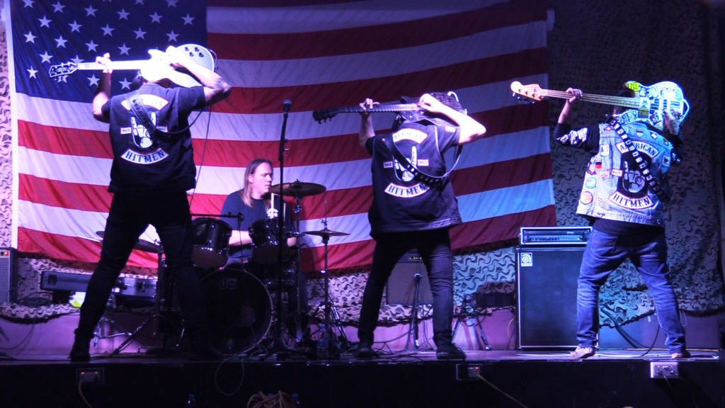 American Hitmen on stage during the Armed Services Entertainment tour with Jack Mandaville. Photo courtesy of Ty Coleman/Rogue Digital.