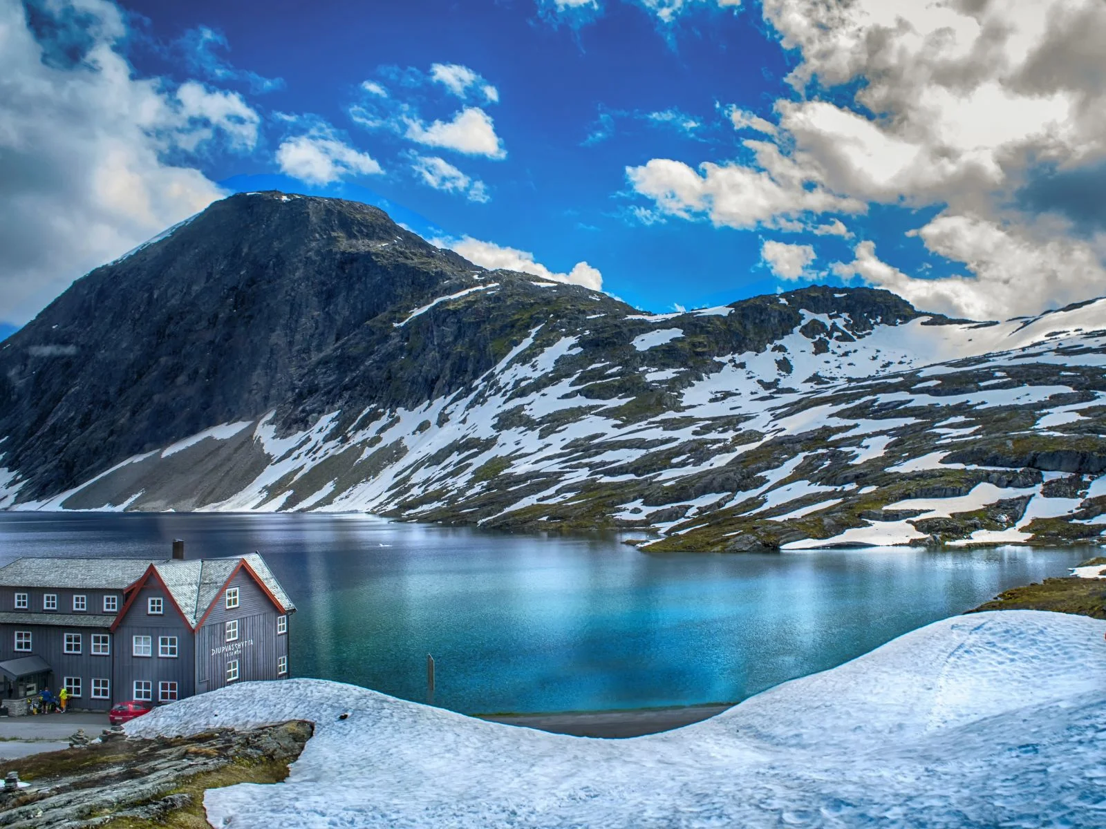 a mountain and a lake in the winter in a Nordic country