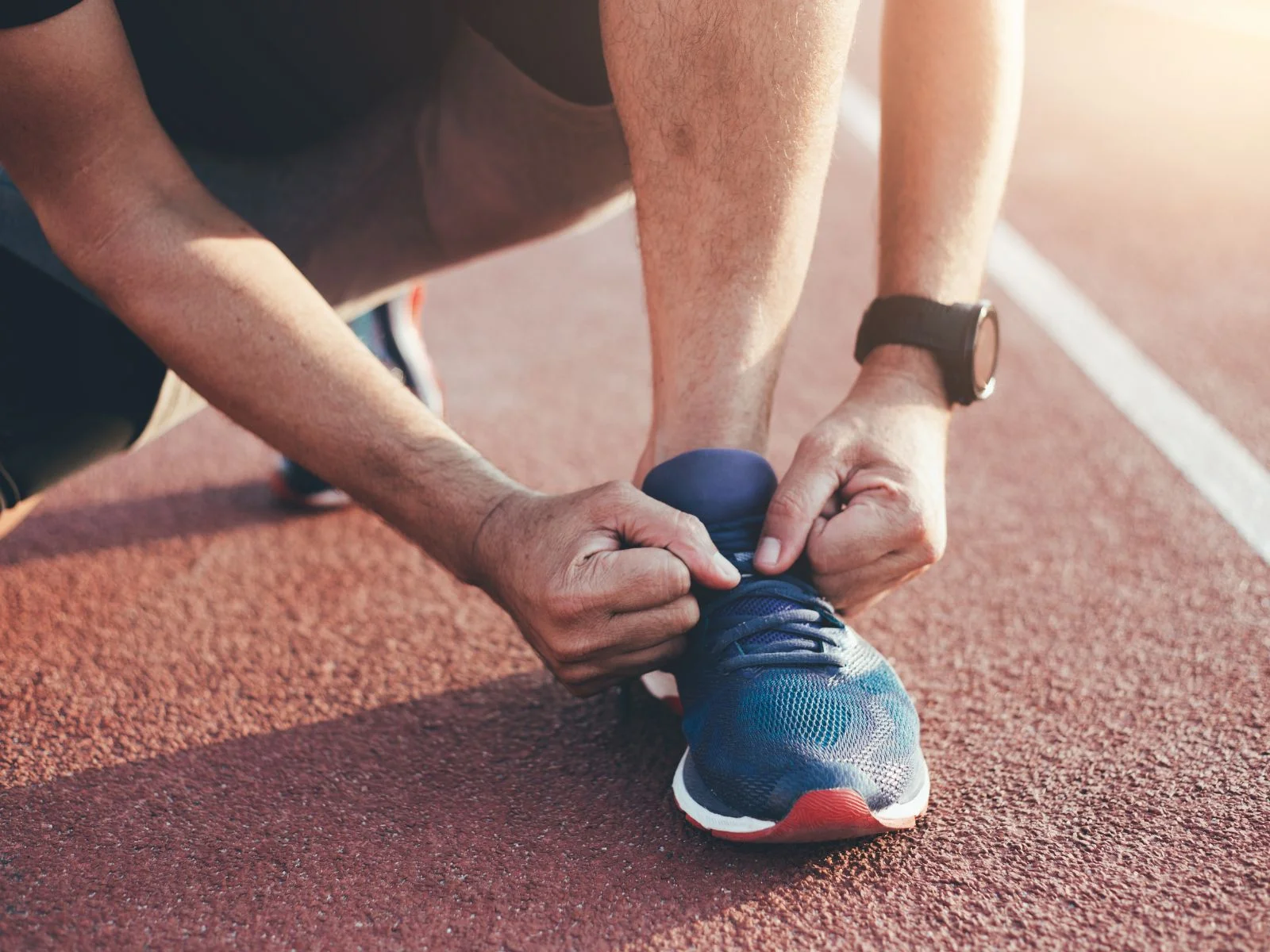 man tying his shoes