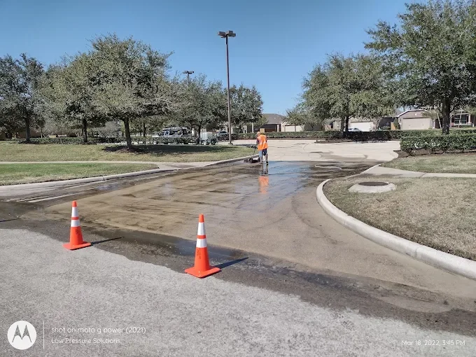 Professional pressure washing team in action