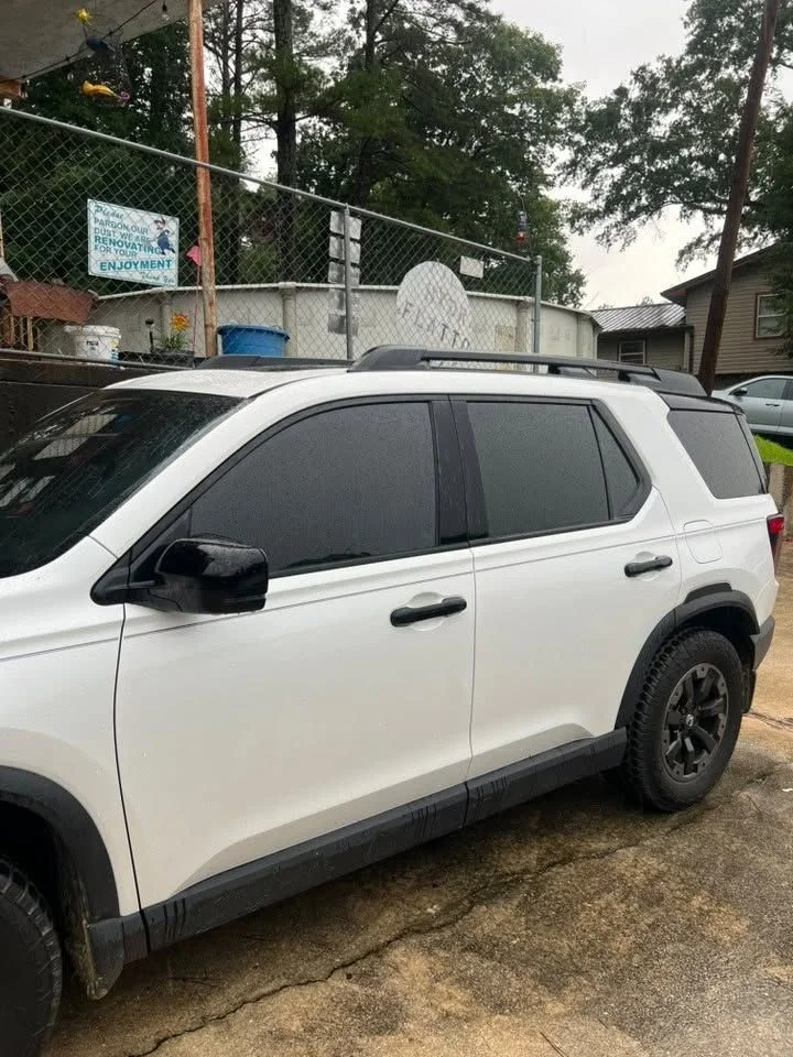 White SUV with fresh dark window tint