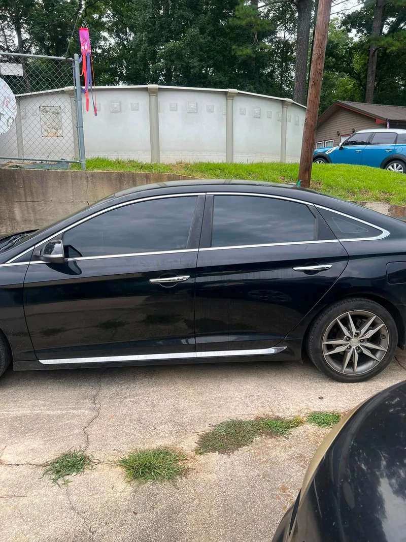 Black sedan with dark ceramic window tint
