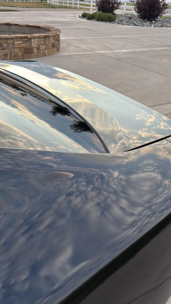 Black car rear glass and trunk after detailing