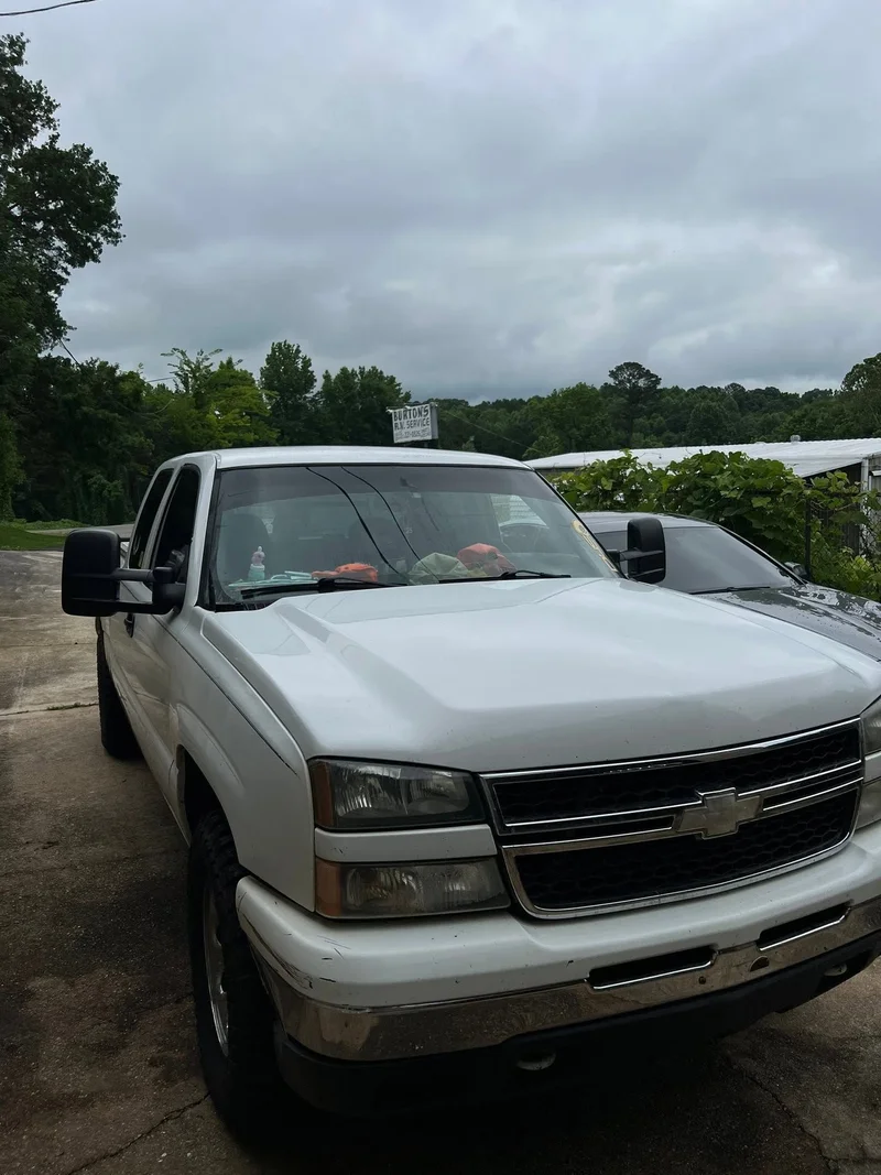 White Chevrolet pickup with window tint