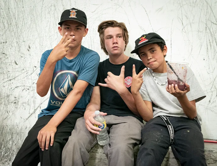 Lots of staring into the camera and throwing up the peace sign, this kid in the
middle opts out with a distant stare and a hangloose.

<!--damnamla22qualifiers-->