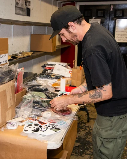 Alec putting together prize packages in the warehouse in preparation for the contest <!--harvestjam21-->
