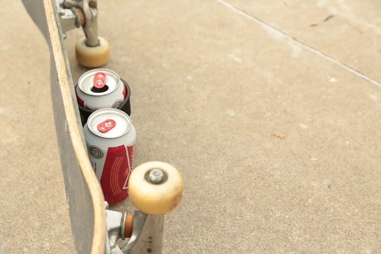 <!--lakaiflare-->

Skateboard doubled up as beer shield for some of the media dudes.
