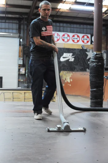 Crash is vacuuming our living room before guest arrive.<!-- New 2013 Street Course at Skatepark of Tampa -->