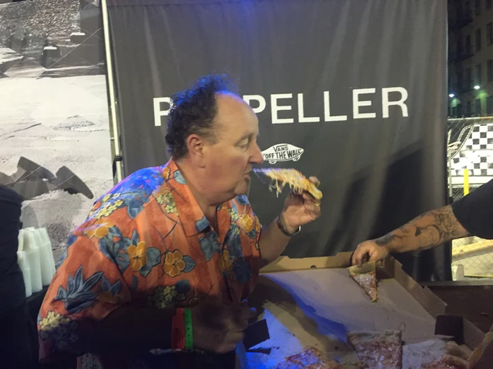 <!--vansca-->

The line for free beer was getting pretty unruly while kegs were getting switched out, so Steve himself took it into his hands to keep the crowd hyped. Serving pizza out to all and taking time to grab a slice for himself. Going above and beyond to make sure everyone was having a great time.