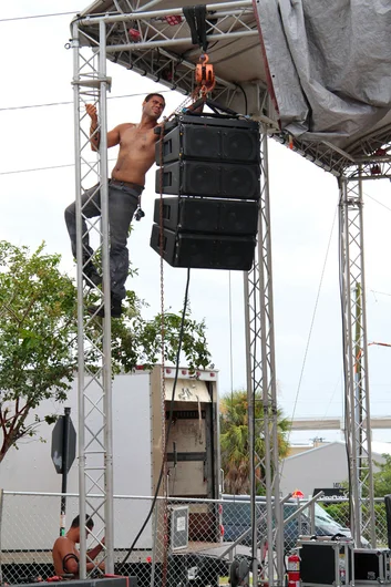 <!--bricks5year-->
Brave people setting up the stage.