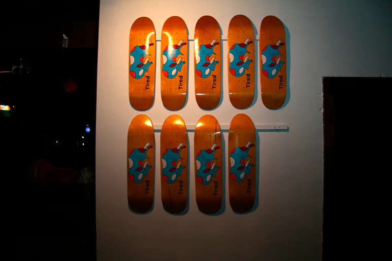 <!--pro14night3-->

If you haven't heard about Tired skateboards yet, check them out.  Piet Parra does the artwork and they are bringing back some old school shapes.  Here's where the stolen board was hanging.