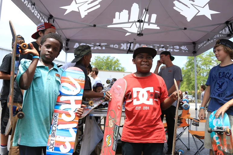 <!--gsd14-->
We'd planned to give away one deck for the worst deck in the crowd. These two kids' boards were so bad, we had to hook them both up on a fresh piece of wood. Their faces say it all.