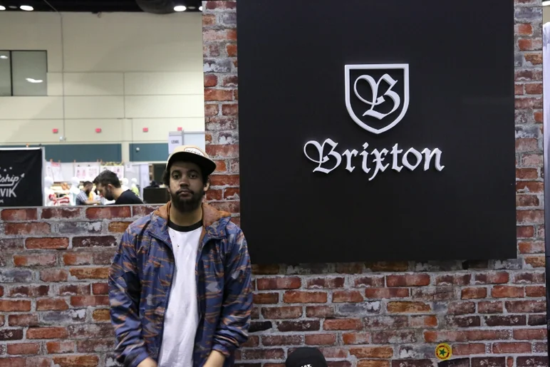 <!-- surfexpoJan2014 -->
From one trade show to another, Alex Bowers is fresh off the plane from the Agenda trade show right to business at the Brixton booth at Surf Expo.