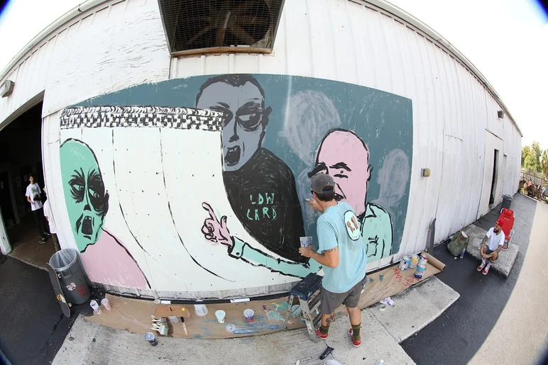 <!-- russpopevans -->

Here's Russ putting the finishing touches on the first mural he painted.