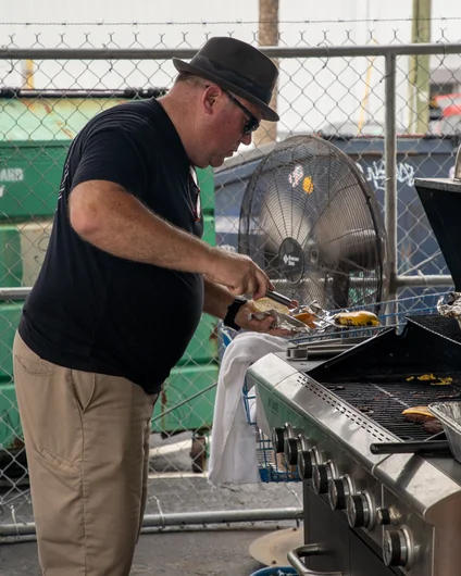 Boards for Bros executive director Woody was the executive grill master for the day  <!--harvestjam21-->