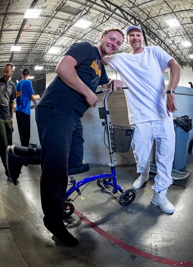 <!--dala18quals-->

Some random dude dressed in all white was super hyped to get a photo with Derick (the registration guy) and his cart.
