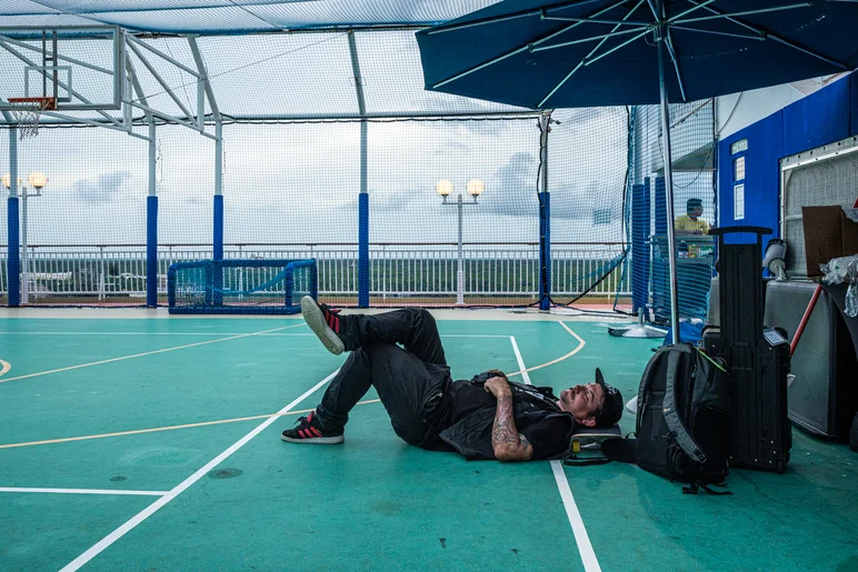 All that drinking making the boys feel rough. Alex Vestal lying on the deck trying to collect himself from last night's mischief. 

<!--floggingmollycruise23-->