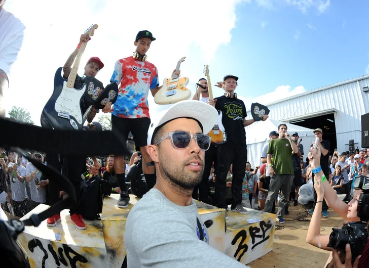 <!--finalspro14-->

Right as the champagne poppped, Eric Koston ran on stage for this epic selfie. Oh, and the camera strap poking in from some guy's camera is about to ruin my champagne shot.
