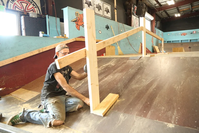 <!--coursephotos16-part2-->
Welder Jeff getting ready to mount a new rail here.