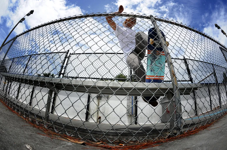 <!-- FranksForNothingLakeLand -->
Here's another one that didn't make it into the edit. Sam sliding completely vertical on this frontside bluntslide up against a chain-link fence. He did so many tricks it was hard for Frank to capture them all.