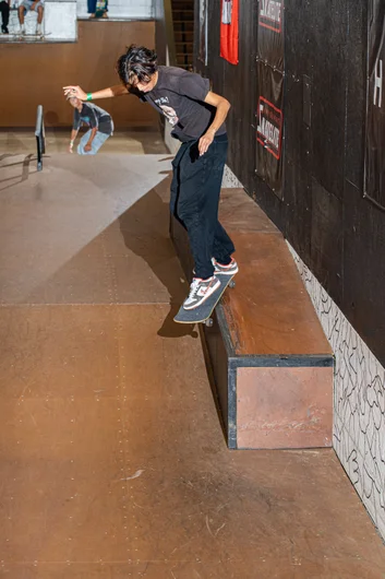 Marcus delivers a back smith down the hubba.

<!--harvestjam2022-->