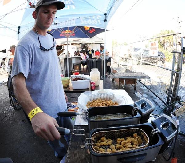 <!-- amdec13sat -->

The gator bites were a hit. Here, Frank's brother Daniel pulls another batch from the fryer.