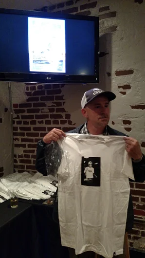 <!--bokmaartshow-->

Mike Frazier sizes up his shirt.