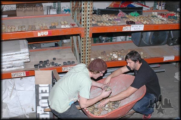 Aaron and Barak putting together sets of wheels