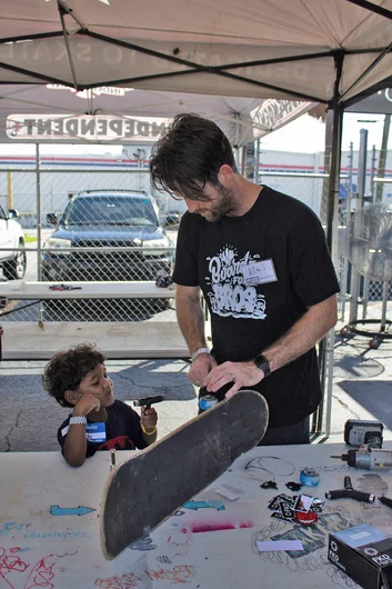 <!--mattwoodsday18-->

That's Alex Sherrer helping one of the kids put his board together. You might recognize him as part of the FSEC (Former SPoT Employee Club). Alex has kids himself, so he knows how important this is.