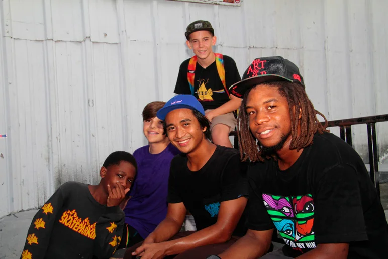 <!--eotmjune15-->
Markus and Uncle Sam chilling with the locals and some campers.