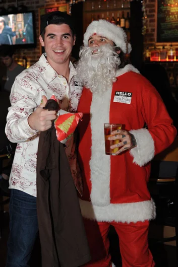 Matt Woods getting gifted by drunk Santa.<!-- SPoT Employee Christmas Party at The Bricks 2012 -->