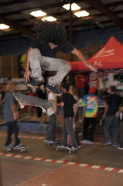 Yonnie on a nollie backside flip over the hip