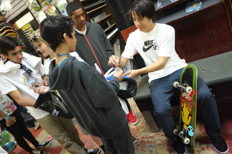 Malto's got a line for signatures in the Shop.<!-- Tampa Pro 2013 Skateboarding and the After-Party -->