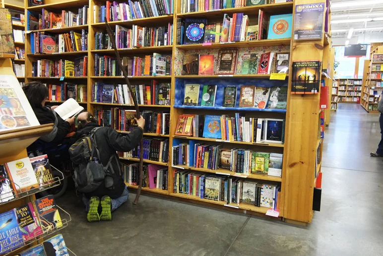 This dude's in the bookstore with six foot tree branch cane and skullet double pony tail.  Wow.  That beats Austin, Texas for weridness any day.<!-- Portland 2013 for Some Nike Bid'niss -->