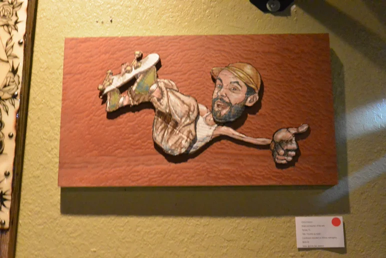 <!--bokmaartshow-->

An amazing art piece by Chris Deacon which sold very fast. He sketched/painted Justin from 2 different photos on cardboard. Cut out and mounted on African mahogany. Beautiful!  