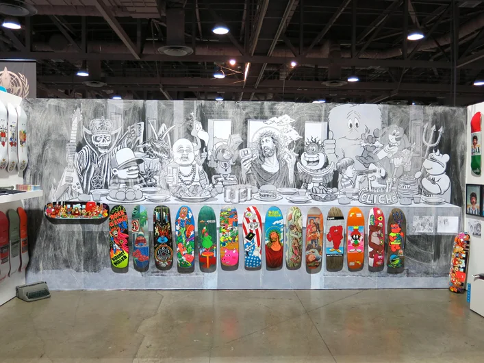 <!--agenda14-->

Day 2 of the trade show, and Cliche was our first appointment. Their booth was by far one of the best at the show. The art is a creative from the classic graphics along the bottom. Taking imagery from each deck combined into one Last Supper image. It’s good to see a great homage piece to the days of when a skateboard graphic meant a bit more than just pumping out new decks constantly. The board will be out in Holiday, and comes in heat transfer and screen print for the collectors.












